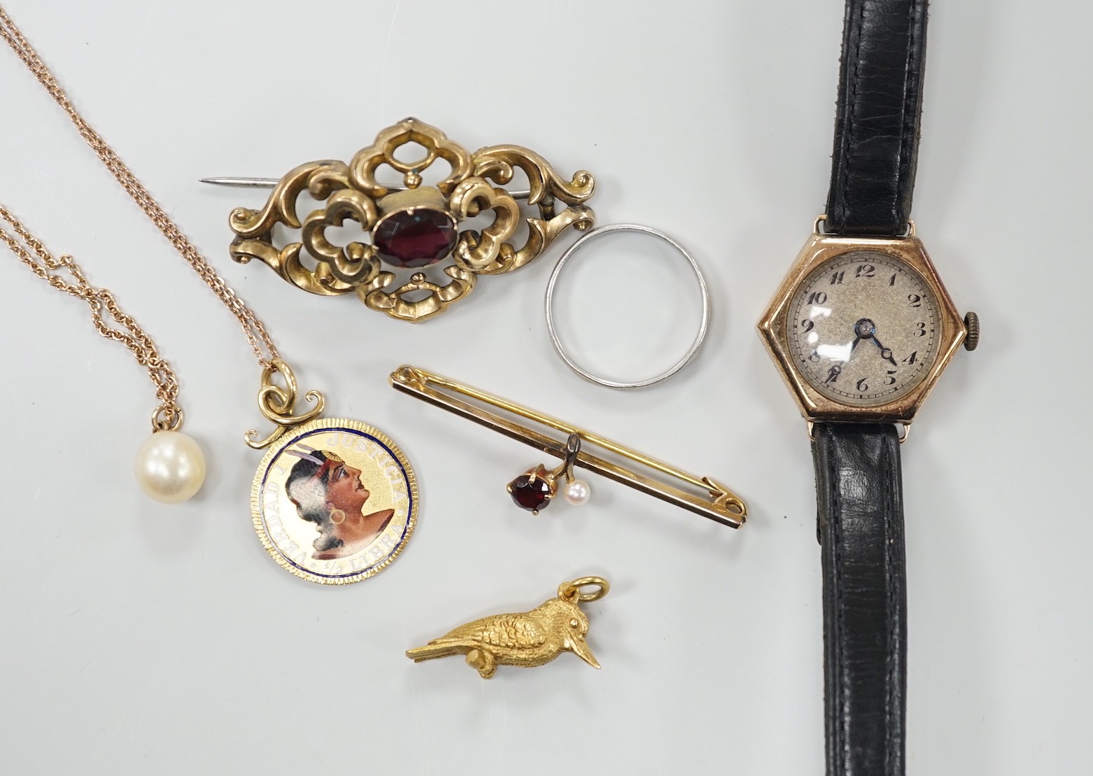 A platinum wedding band, 2.3 grams, a 9ct gold, garnet and seed pearl set bar brooch, a bird charm, a yellow metal and enamelled pendant on a 9ct chain, a 9ct and cultured pearl pendant necklace, a lady's 9ct gold hexago